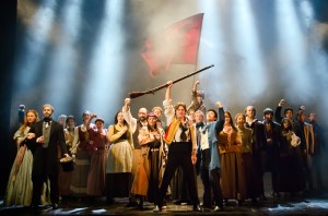 Ensemble, including Cosette (Lauren Wiley) and Jean Valjean (Peter Lockyer) on the left, and Enjolras (Jason Forbach) and Marius (Devin Ilaw) in the center. Photo by Kyle Froman.